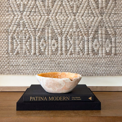 Natural zebra calcite crystal bowl hand carved with orange calcite and white banded stone pattern.