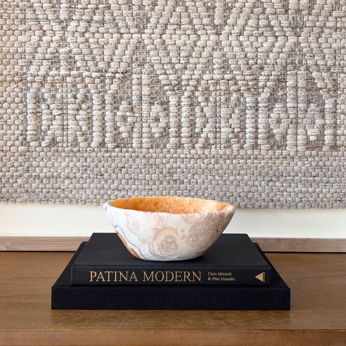 Decorative zebra calcite bowl with organic banding and polished finish, styled home accent piece