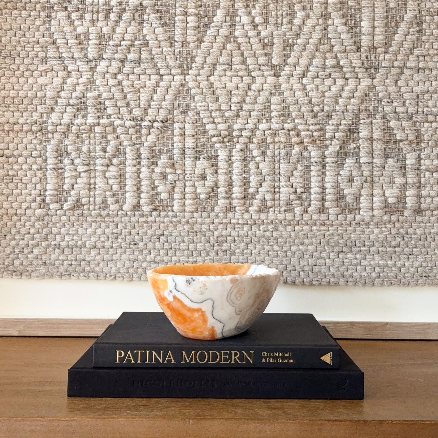 Zebra calcite bowl with rich orange calcite exterior and polished interior, modern stone decor styling