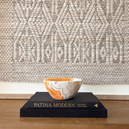 Zebra calcite bowl with rich orange calcite exterior and polished interior, modern stone decor styling