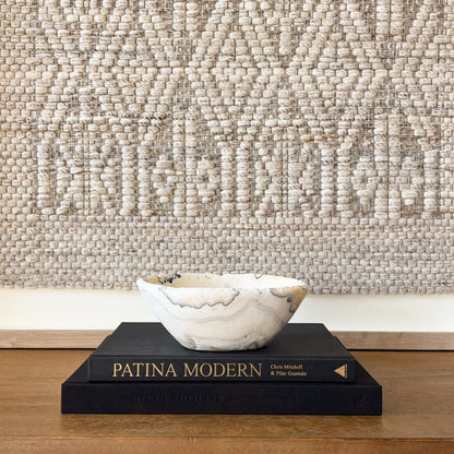 Zebra calcite stone bowl with high-gloss polish and natural mineral banding detail