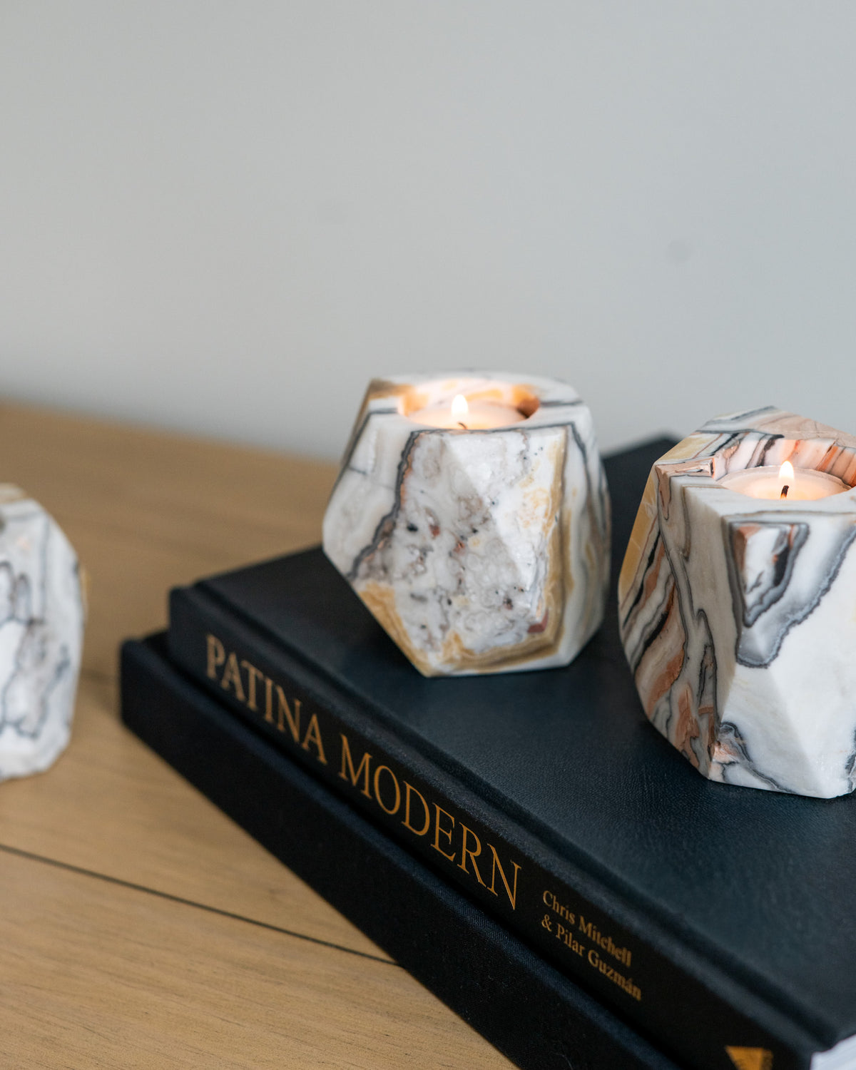 Assorted zebra calcite candle holders showing natural variations in color and pattern