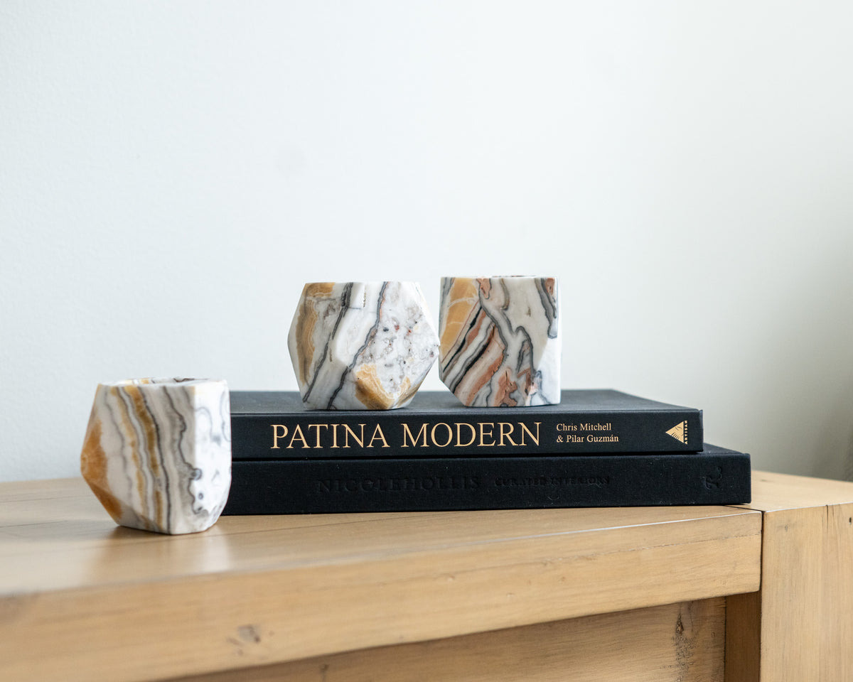 Natural zebra calcite candle holder with distinctive striped stone pattern