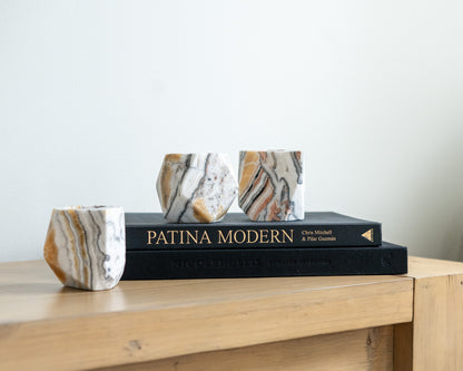 Natural zebra calcite candle holder with distinctive striped stone pattern