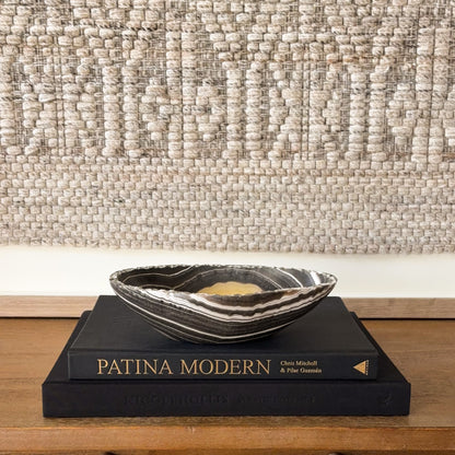 Hand carved zebra onyx stone bowl in earthy yellow, black and cream tones