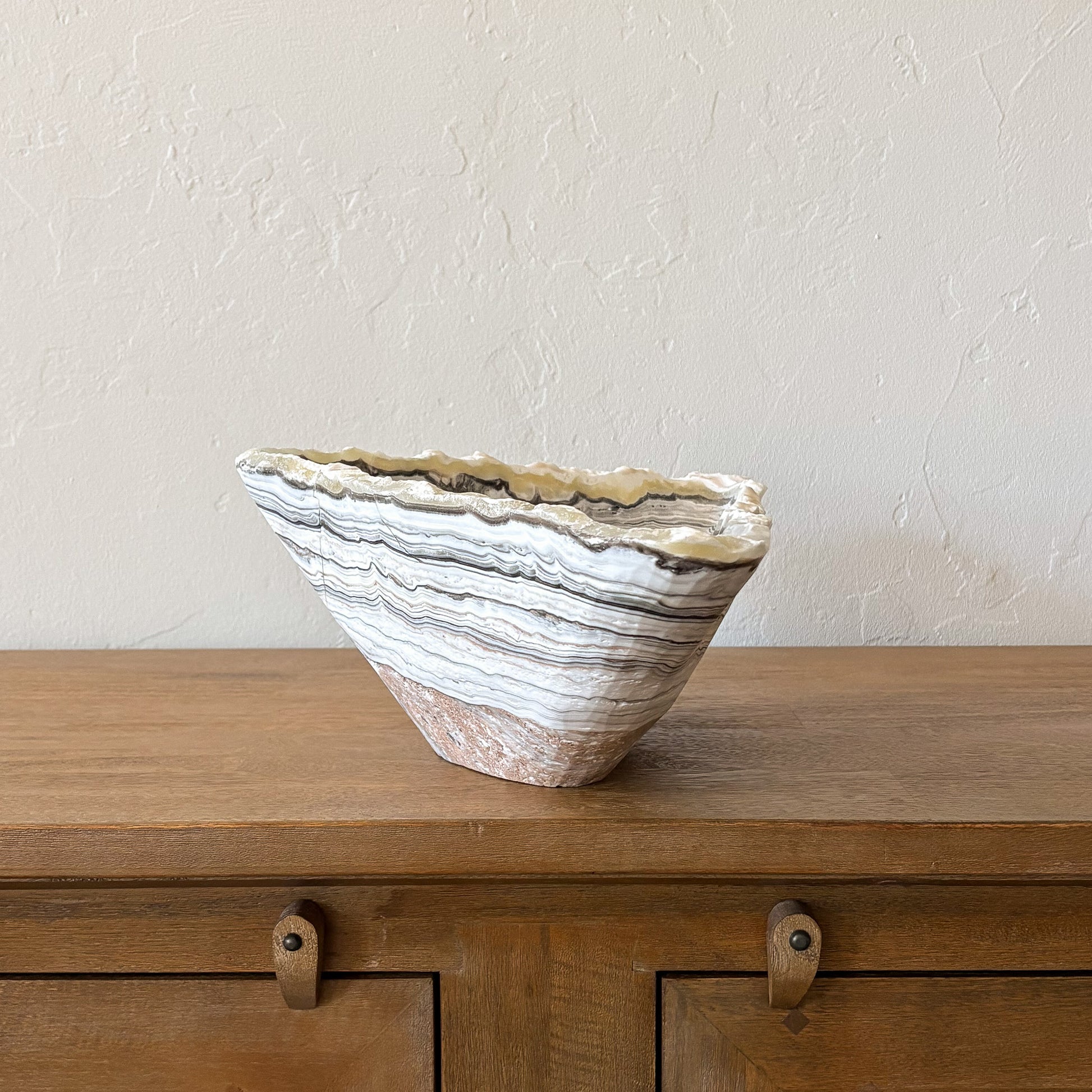 Large natural zebra onyx centerpiece bowl with dramatic layered stone pattern for luxury interior decor