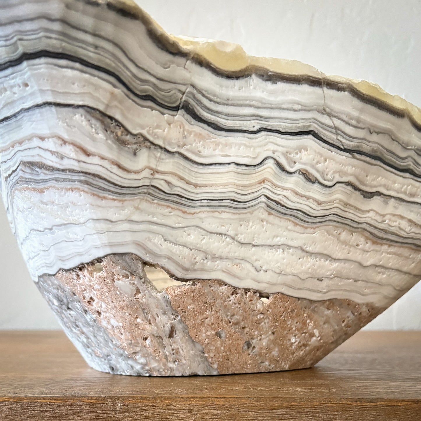 Artisan carved zebra onyx bowl centerpiece with unique striped stone pattern