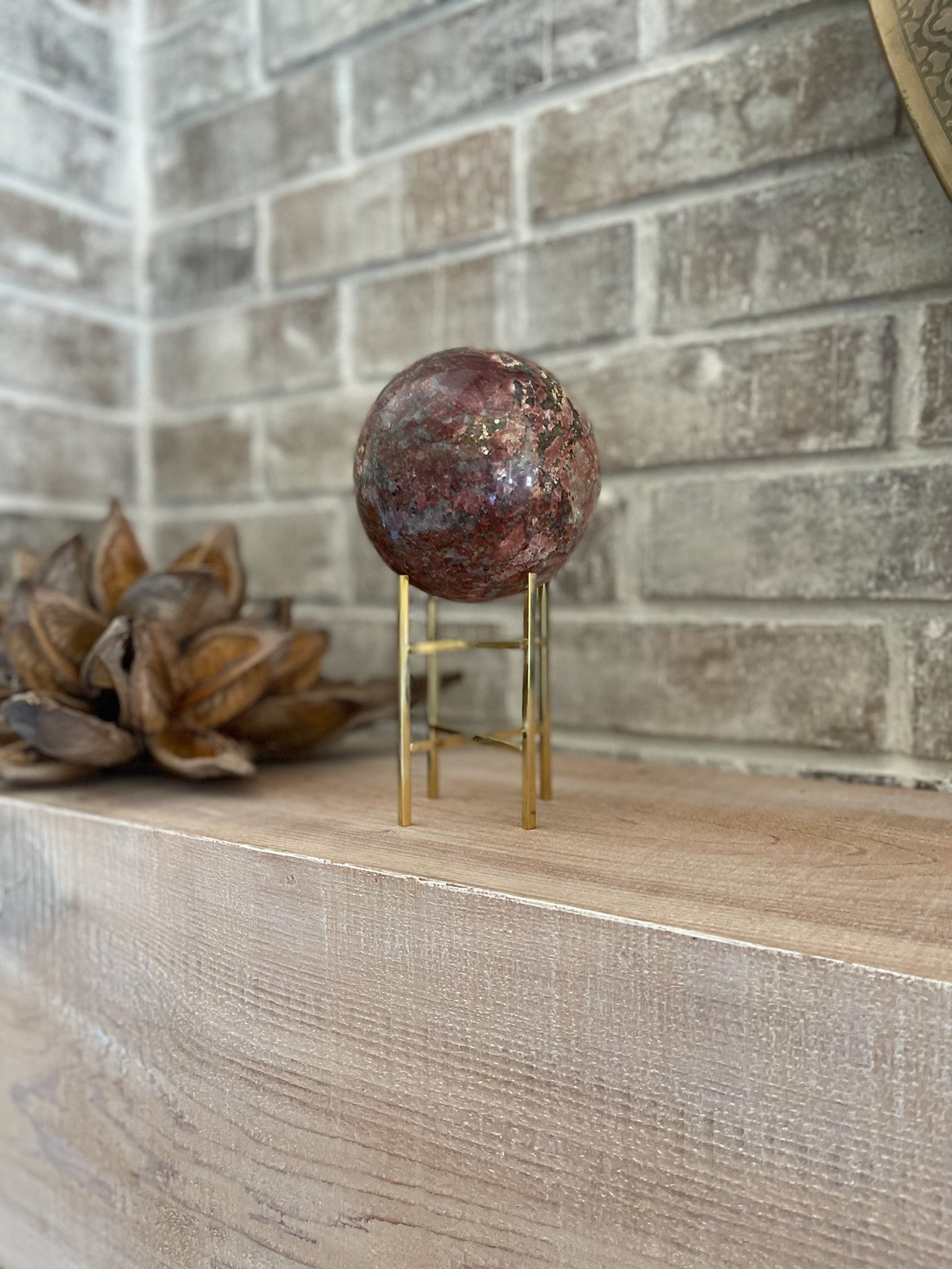 madagascar red opal crystal ball on gold stand