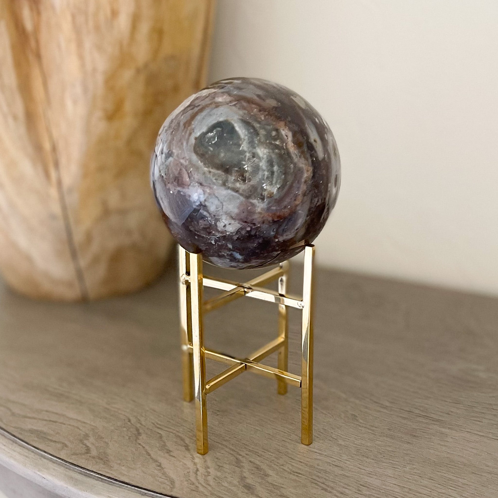 madagascar ocean jasper crystal ball on gold stand, decorative object