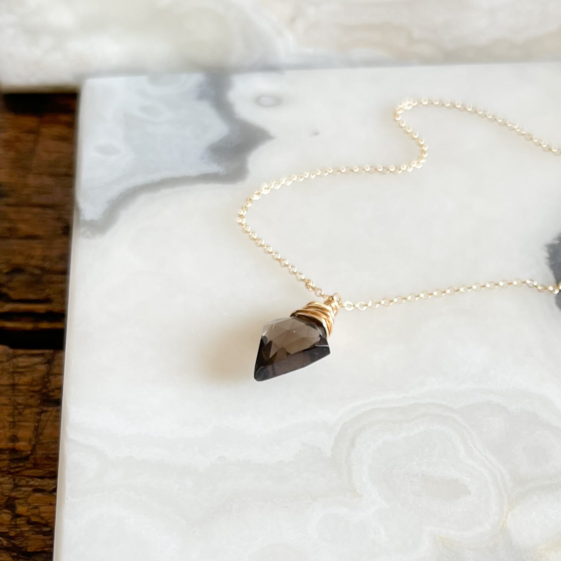 Gold necklace with smoky quartz arrow pendant